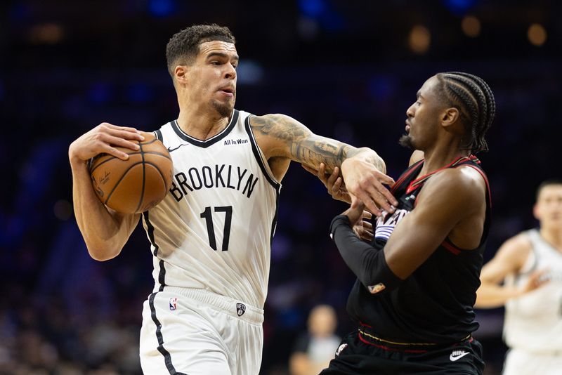 Dec 23, 2025; Philadelphia, Pennsylvania, USA; Brooklyn Nets forward Michael Porter Jr. (17) drives against Philadelphia 76ers guard Tyrese Maxey (0) during the first quarter at Xfinity Mobile Arena. Mandatory Credit: Bill Streicher-Imagn Images