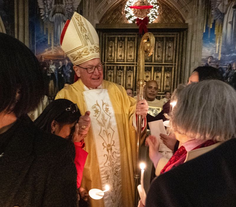 Cardinal Timothy Dolan greets parishioners before leading his final midnight mass Christmas service at St. Patrick's Cathedral in Manhattan Dec. 25, 2025.