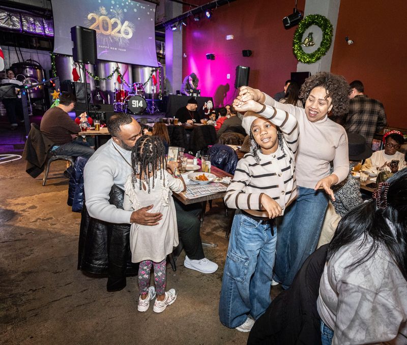 Dayanna Carrion of Riverdale dances with her daughter Layleh, 8, during a "Noon Year's Eve" party at the Yonkers Brewing Co. Dec. 31, 2025. The afternoon family style party included face painting, music, dancing, and a midday 2026 ball drop. During the evening hours, the restaurant and bar was transformed into a speakeasy that hosted an adult New Year's celebration.