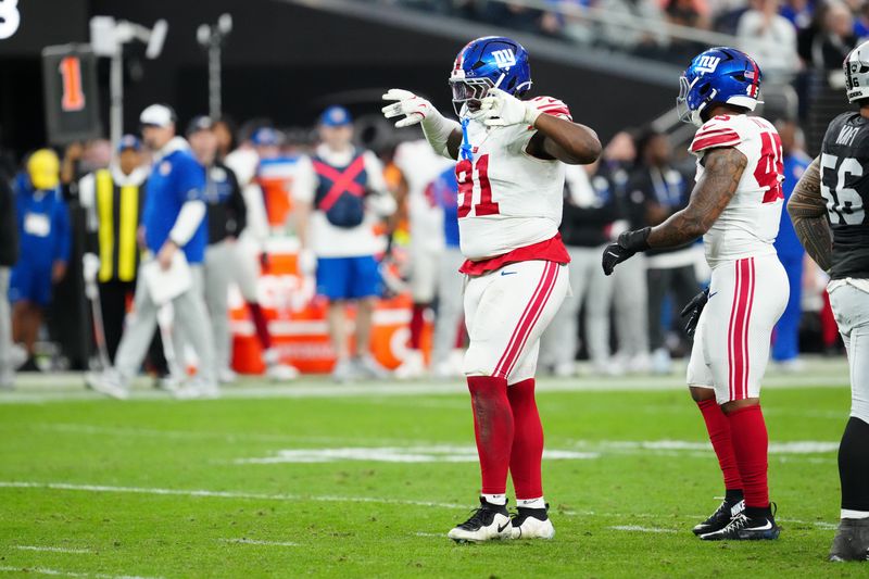 Dec 28, 2025; Paradise, Nevada, USA; New York Giants defensive lineman Darius Alexander (91) reacts in the fourth quarter against the Las Vegas Raiders at Allegiant Stadium. Mandatory Credit: Stephen R. Sylvanie-Imagn Images