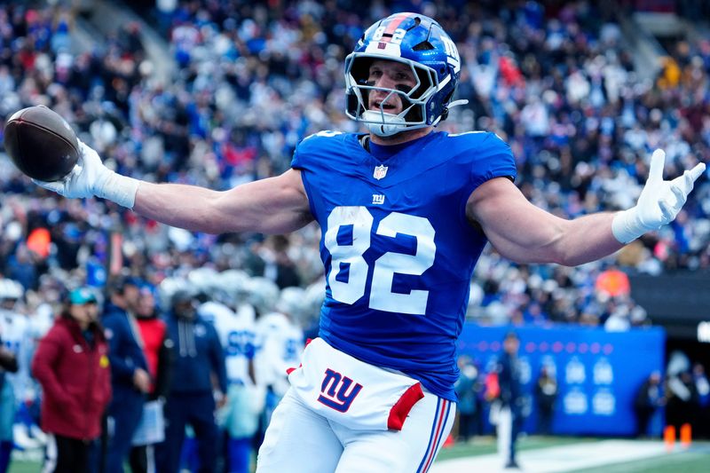 New York Giants tight end Daniel Bellinger (82) scores Big Blue's first touchdown of the game, Sunday, January 4, 2026, in East Rutherford.