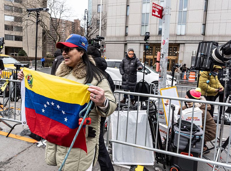 Maria Su, who lives in Manhattan, fled Venezuela in 2017. She said "Thank you Donald Trump, Thank you America" as she stood outside the Federal Courthouse in lower Manhattan where Maduro is scheduled to be arraigned Jan. 5, 2026.
