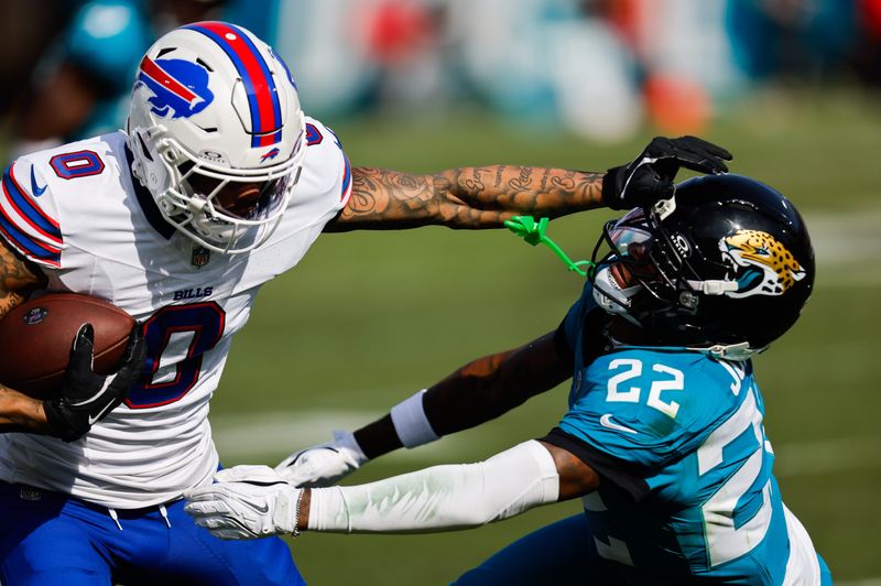 Jacksonville Jaguars cornerback Jarrian Jones (22) denies a touchdown by Buffalo Bills wide receiver Keon Coleman (0) during the second quarter in an NFL football AFC Wild Card playoff matchup, Sunday, Jan. 11, 2026, in Jacksonville, Fla. Bills lead 10-7 at the half over the Jaguars. [Doug Engle/Florida Times-Union]