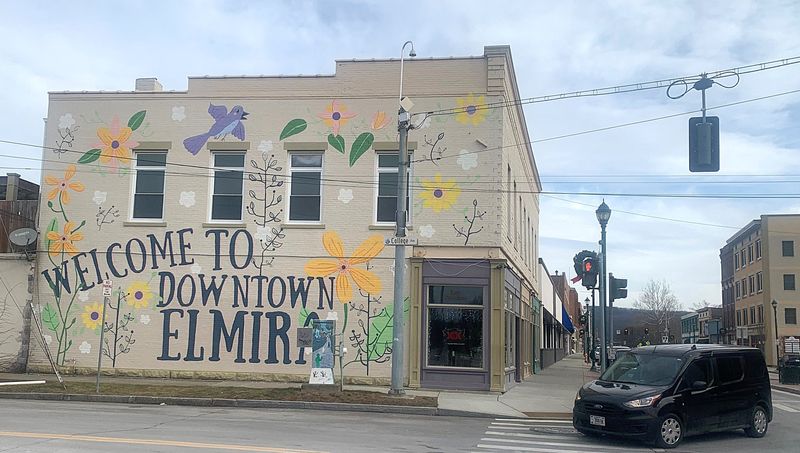 "Share the Sunlight," a mural by artist Filomena Jack, graces a building at the corner of West Water Street and College Avenue in Elmira, and is an example of public art promoted by Community Arts of Elmira.