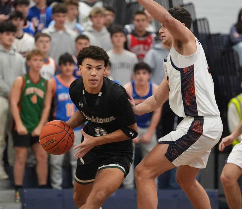 Yorktown's Colin Worden (0) works around Horace Greeley's Samuel Bourne (33) during their 50-44 win in boys basketball at Horace Greeley High School in Chappaqua on Wednesday, January 14, 2026.
