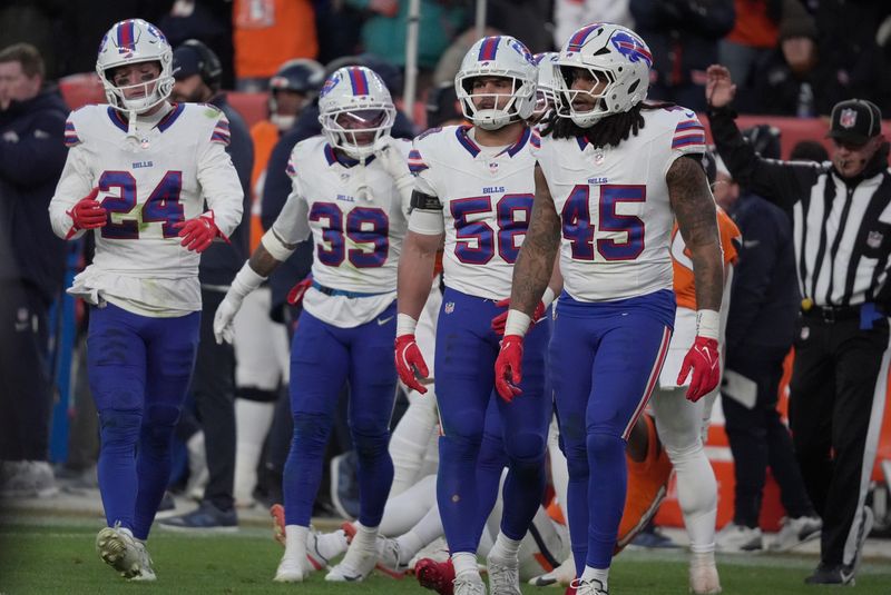 Buffalo Bills safety Cole Bishop,cornerback Cam Lewis, linebacker Matt Milano, and linebacker Shaq Thompson head to the line of scrimmage during second half action at Empower Field at Mile High in Denver, Colorado on Jan. 17, 2026.