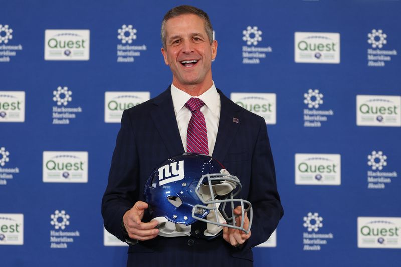 Jan 20, 2026; East Rutherford, NJ, USA; John Harbaugh poses after the press conference announcing his hiring as the next New York Giants head coach at Quest Diagnostics Training Center. Mandatory Credit: Ed Mulholland-Imagn Images