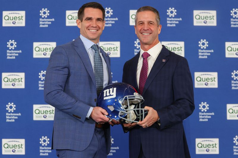 Jan 20, 2026; East Rutherford, NJ, USA; New York Giants general manager Joe Schoen and head coach John Harbaugh pose after the press conference announcing Harbaugh’s hiring at Quest Diagnostics Training Center. Mandatory Credit: Ed Mulholland-Imagn Images