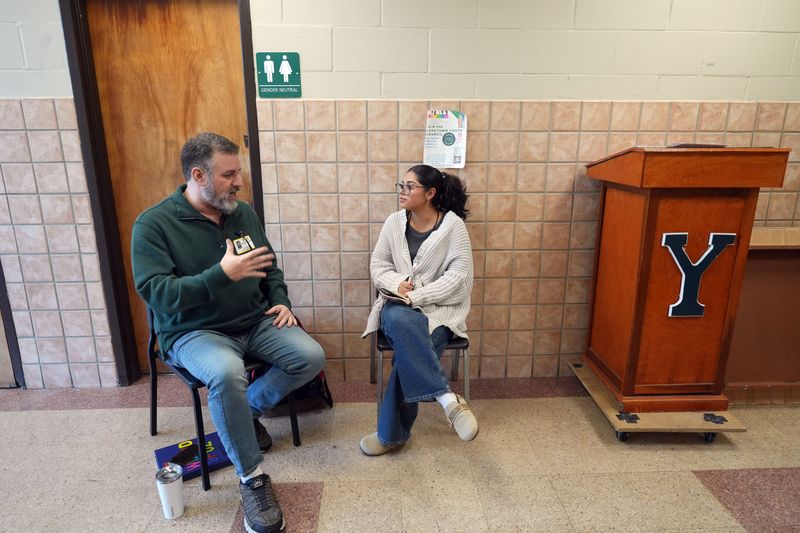 Freelance reporter Michelle Grisales, right, interviews Jeremy Newberger, director of The Wizard of Oz musical at Yorktown High School, Jan. 12, 2026 in Yorktown Heights. Yorktown will present the Wizard of Oz on March 6, 2026 and March 7, 2026.