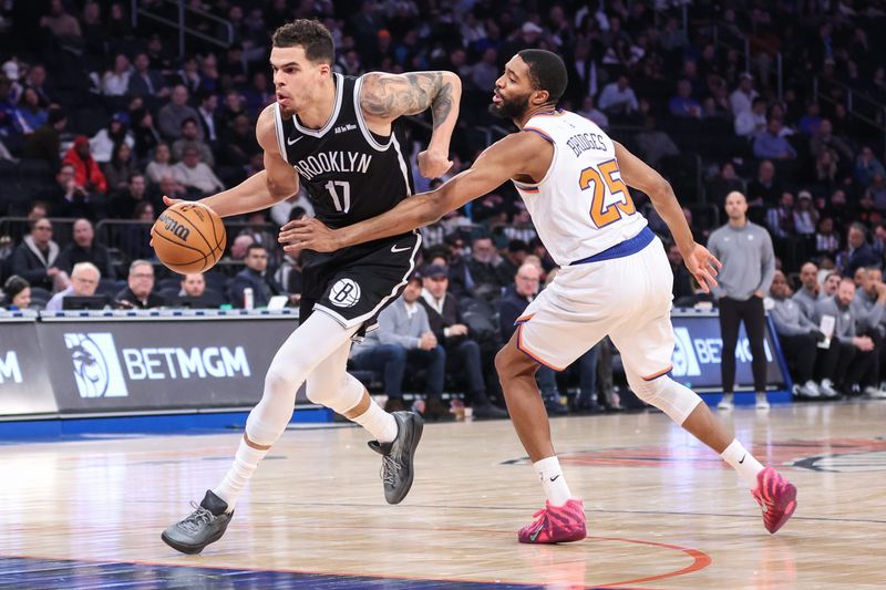 Jan 21, 2026; New York, New York, USA; Brooklyn Nets forward Michael Porter Jr. (17) drives past New York Knicks guard Mikal Bridges (25) in the third quarter at Madison Square Garden. Mandatory Credit: Wendell Cruz-Imagn Images