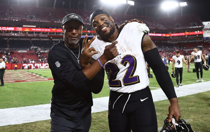 Oct 21, 2024; Tampa, Florida, USA; Baltimore Ravens running back Derrick Henry (22) celebrates with running back coach Willie Taggart after they beat the Tampa Bay Buccaneers at Raymond James Stadium. Mandatory Credit: Kim Klement Neitzel-Imagn Images