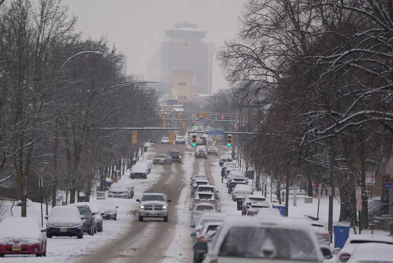 Overnight snowfall left the morning commute a little slippery on Jan. 22, 2026. A view of downtown Rochester from Monroe Avenue.