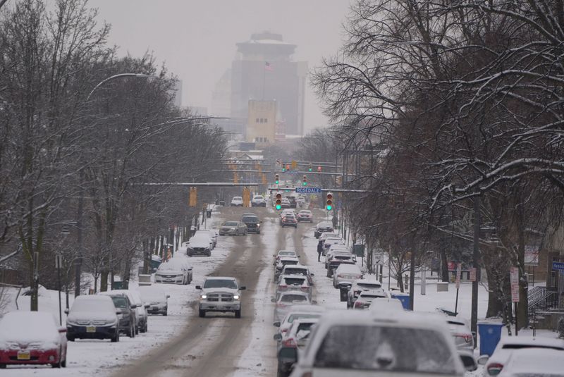 Overnight snowfall left the morning commute a little slippery on Jan. 22, 2026. Downtown Rochester can be seen from Monroe Avenue.