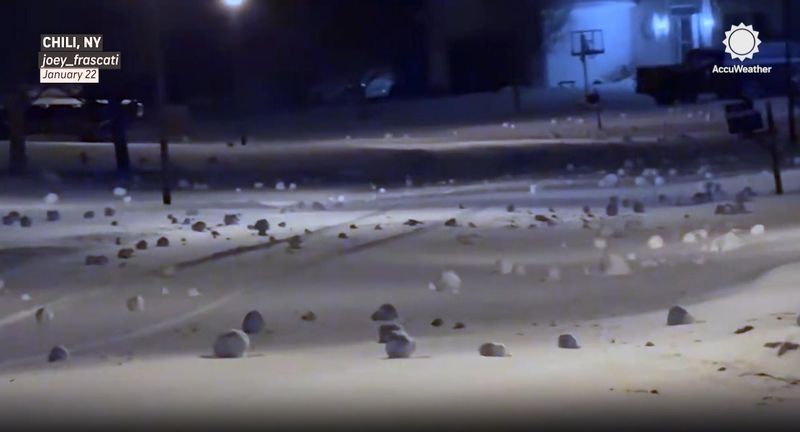 Dozens of "snow rollers," naturally made snowballs that can grow as large as car, are scene in the screenshot of video shot in Chili neighborhood.