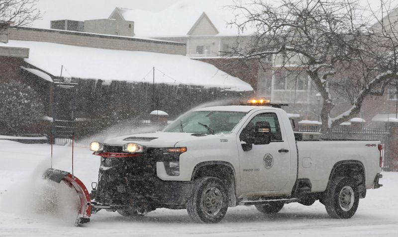 Rochester city snowplows were out in force to try and keep up with the steady falling snow in downtown Rochester Sunday, Jan. 25, 2026 as a large winter storm rolls into New York. The storm is expected to dump a foot of snow across Western New York.