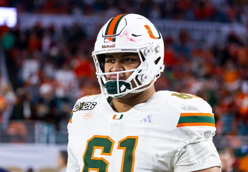 Jan 19, 2026; Miami Gardens, FL, USA; Miami Hurricanes offensive lineman Francis Mauigoa (61) against the Indiana Hoosiers during the College Football Playoff National Championship game at Hard Rock Stadium. Mandatory Credit: Mark J. Rebilas-Imagn Images