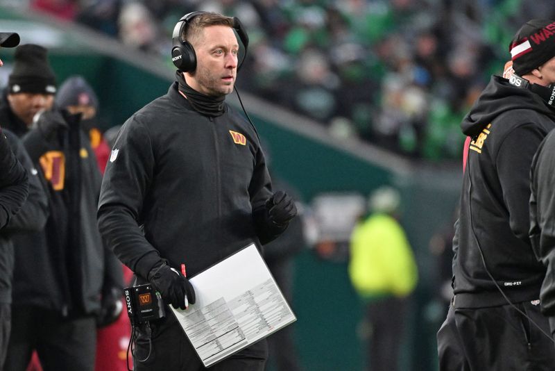 Jan 4, 2026; Philadelphia, Pennsylvania, USA; Washington Commanders offensive coordinator Kliff Kingsbury on the sidelines against the Philadelphia Eagles at Lincoln Financial Field. Mandatory Credit: Eric Hartline-Imagn Images