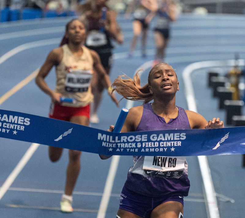 Alivia Smith of New Rochelle breaks the tape as New Rochelle wins the Freshfields Girls' 4 x 400 Suburban race during the Millrose Games at the Nike Track and Field Center at the Armory in Manhattan Feb. 1, 2026.