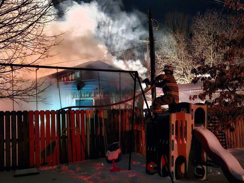 Firefighters work at putting out a fire at 4 Hidden Lane in the village of Arkport on Feb. 3, 2026.