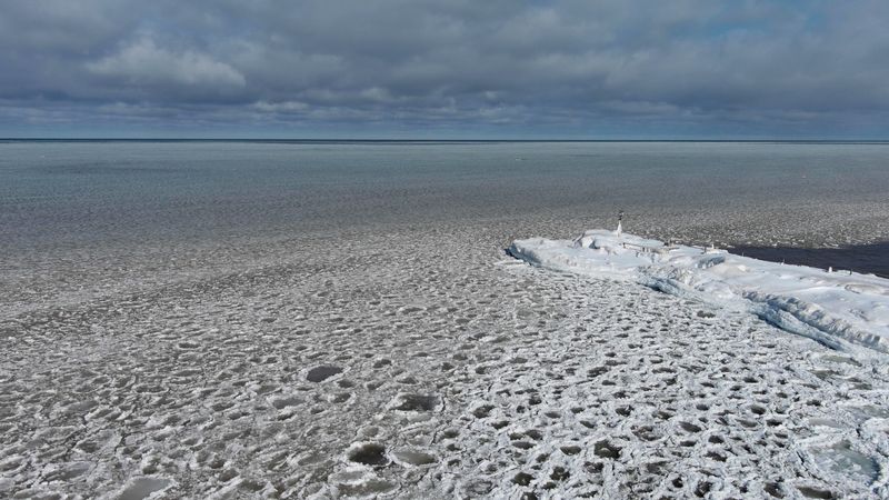 The pier at Webster Park is surrounded by a thin layer of broken ice on Lake Ontario in Webster on Feb. 4, 2026.