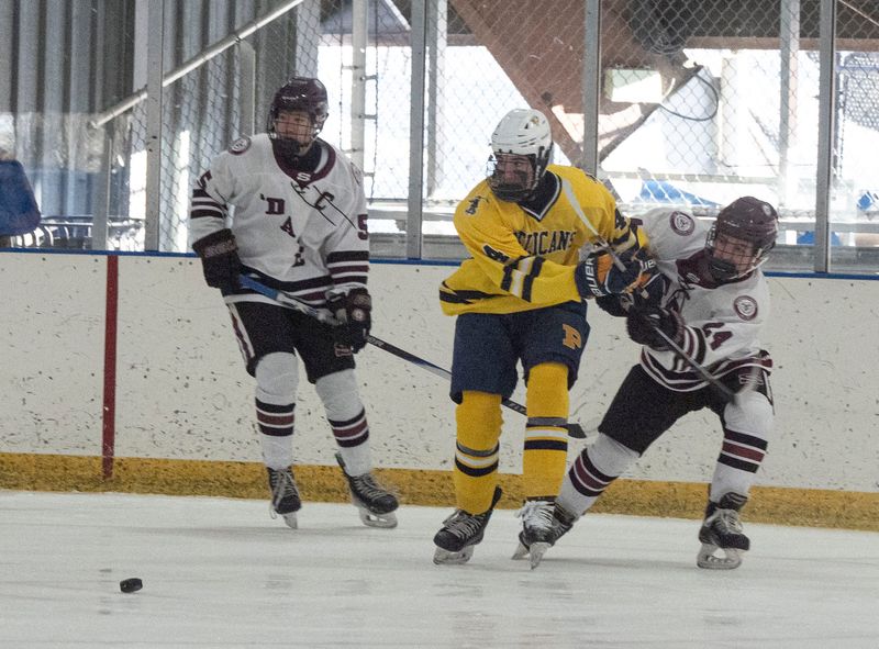 Winston Speros of Pelham battles Ryan Camhi of Scarsdale for the puck during a varsity hockey game at the E J Murray Memorial Skating Center in Yonkers Feb. 4, 2026. Pelham defeated Scarsdale 5-2.