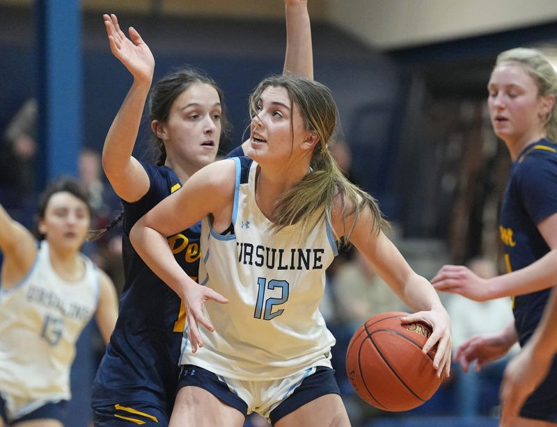 Ursuline's Allison Camas (12) works against Pelham's Maggie Memoli (13) during girls basketball action at The Ursuline School in New Rochelle on Thursday, February 5, 2026. Pelham won 65-61.