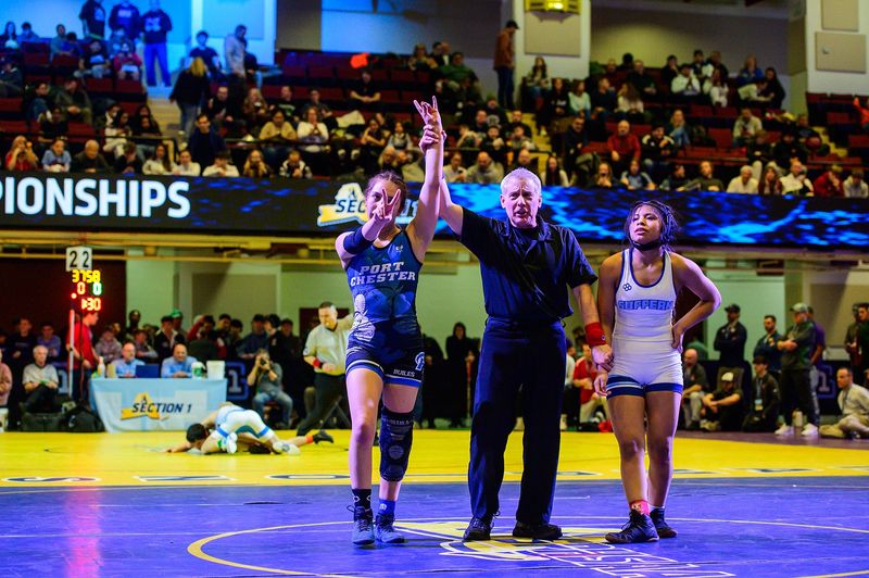 Port Chester's Laila Builes, left, celebrates her win over Suffern's Lesly Chivalran Reel in the 114 pound weight class during the Section 1 girls wrestling championship at the Westchester County Center in White Plains, NY on Sunday, February 8, 2026.