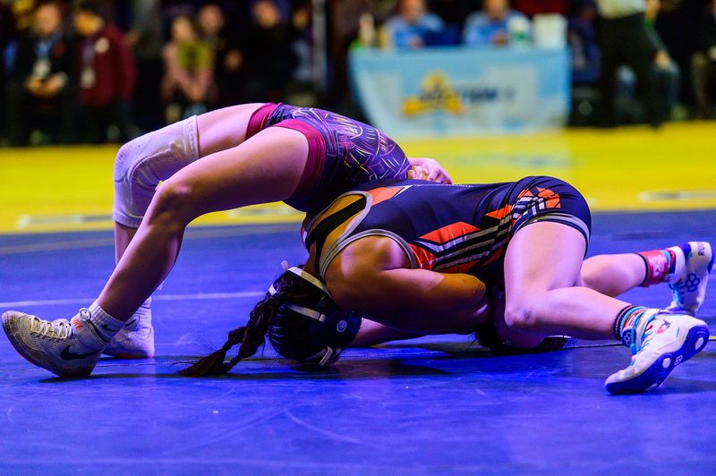White Plains' Genesis Garcia, right, wrestles Arlington's Nicole Shneyder in the 100 pound weight class during the Section 1 girls wrestling championship at the Westchester County Center in White Plains, NY on Sunday, February 8, 2026. Kelly Marsh/For The Journal News