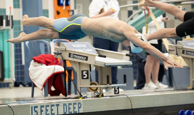 Webster's Jack Frenzel starts the 50 freestyle during the Section V Class A finals Thursday, Feb. 12 at the Webster Aquatic Center. Frenzel won with a time of 20.80 seconds.