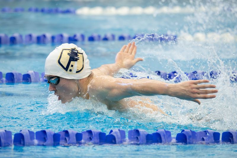 Webster's Jack Frenzel competes in the 100 butterfly final during the Section V Class A finals Thursday, Feb. 12 at the Webster Aquatic Center.