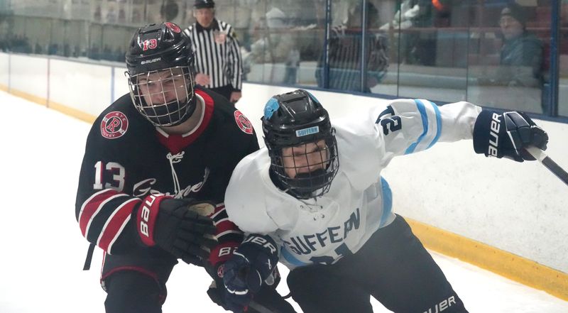 Rye's Julian Levenson fights for the puck with Suffern's Gavin Turco during their game at Sport-O-Rama Feb. 13, 2026. Rye won 5-4.