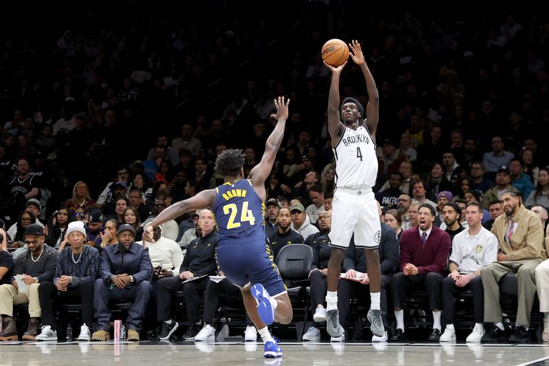 Feb 11, 2026; Brooklyn, New York, USA; Brooklyn Nets guard Drake Powell (4) shoots a three point shot against Indiana Pacers guard Kobe Brown (24) during the second quarter at Barclays Center. Mandatory Credit: Brad Penner-Imagn Images