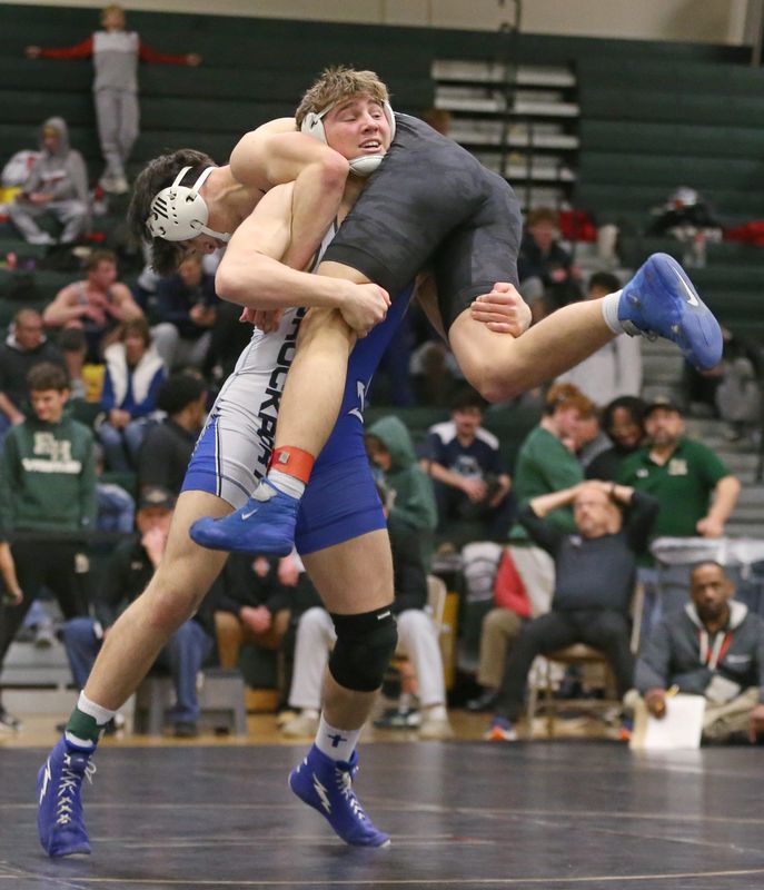 Brockport’s Dylan Fitzgerald gets the take down on Webster Schroeder’s Ethan Clark during their 190 pound first place match during the Section V boys wrestling state qualifiers Saturday, Feb. 14, 2026 at Rush-Henrietta High School. Fitzgerald won the match.