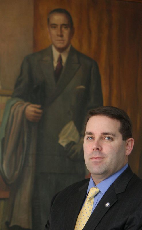 David Pope, head of the Generoso Pope Foundation, stands near a portrait of his great-grandfather, who founded the philanthropic foundation in 1947, and who the foundation is named for. Pope was photographed Feb. 2, 2010 at the foundation's headquarters in Tuckahoe. ( Seth Harrison / The Journal News )