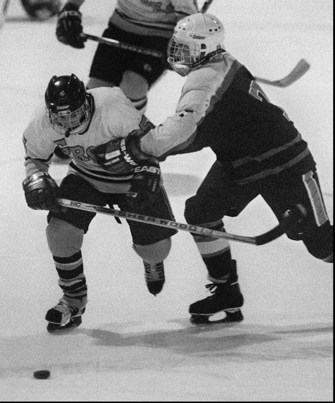 Greece's Joe McArdle fights off a check from Liverpool's Nick Shattell in December 1994.