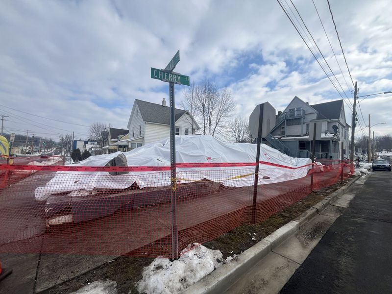 A Cherry Street multi-apartment building was torn down following a fire that displaced over 20 residents.