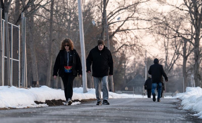 Warm temperatures bring walkers to the path along Congers Lake at Congers Memorial Park on Tuesday, February 17, 2026.