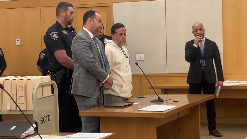 Walter Bustos-Solis, in sweatshirt, with his lawyer Jeffery Greco as he is sentenced Feb. 19, 2026, to 15 years in prison for manslaughter in the June 2024 fatal stabbing of Carlos Rodriguez in Peekskill.