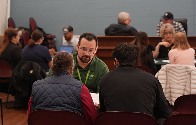 Dylan Miyoshi, A NYSEG customer service representative speaks with customers at Community Connection event sponsored by NYSEG at Carmel Town Hall in Mahopac in Feb. 17, 2026.