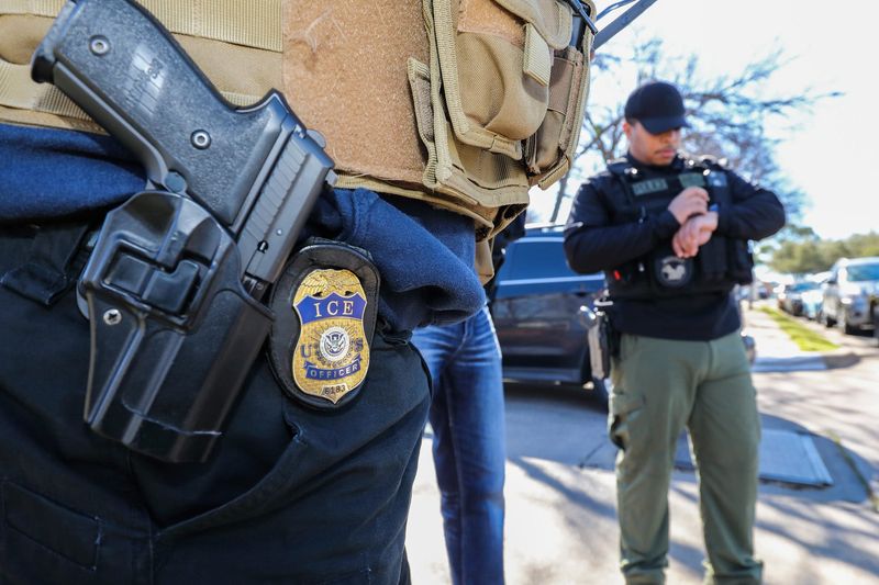 A U.S. Immigration and Customs Enforcement officer participates in an enforcement operation in Dallas, Texas.
