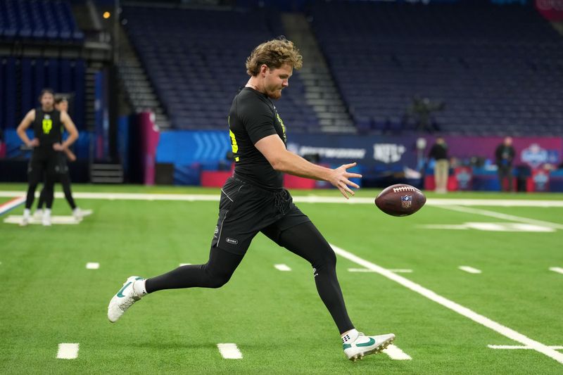 Feb 25, 2026; Indianapolis, IN, USA; Ryan Eckley of Michigan State punts the ball during the NFL Scouting Combine at Lucas Oil Stadium. Mandatory Credit: Kirby Lee-Imagn Images