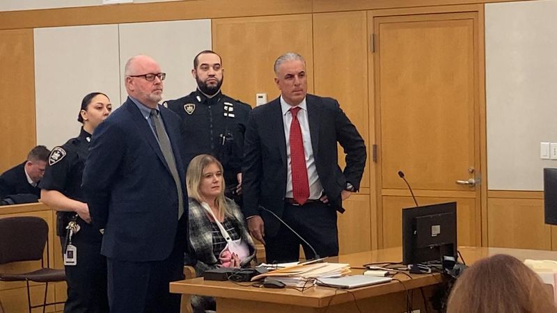 NYPD Sgt Tiffany Howell sits between her lawyers Andrew Quinn, left, and Anthony DiFiore in Westchester County Court March 2, 2026, at her arraignment on homicide and DWI charges in the Jan. 22, 2026, wrong-way crash that killed Manuel Boitel of Peekskill on the Taconic State Parkway in Mount Pleasant.