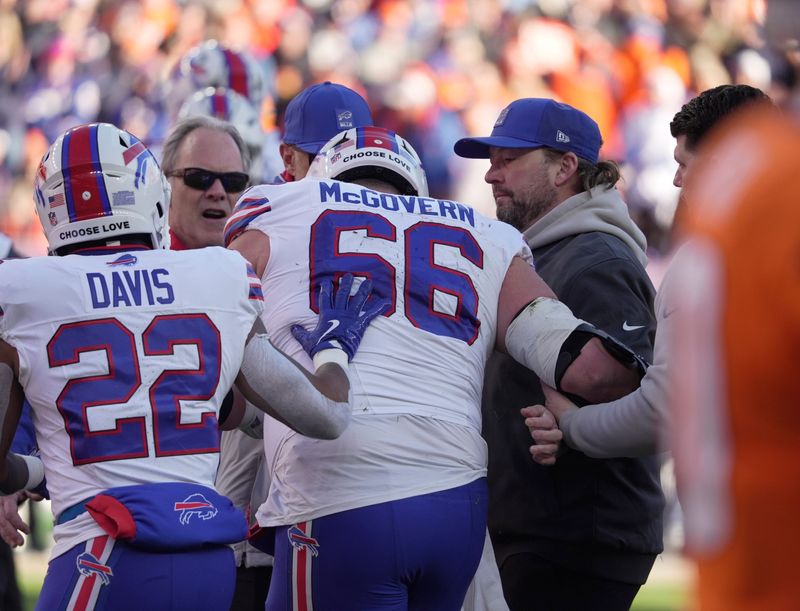Buffalo Bills center Connor McGovern injured on a play wobbles as he stands and is helped off the field during first half action at Empower FIeld at Mile High in Denver, Colorado on Jan. 17, 2026.