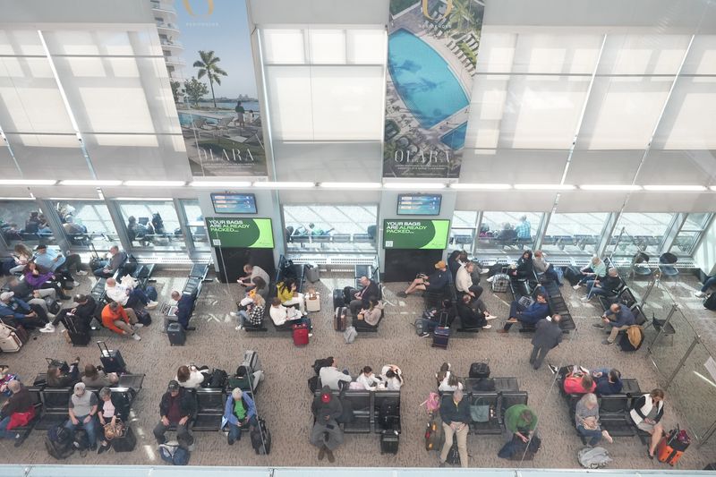 Travelers wait for flights in the departure lounge at Westchester County Airport, March 4, 2026 in White Plains. Westchester County Executive Ken Jenkins announced HNTB, a transit infrastructure architecture firm, has been selected to oversee the new upgrades to the airport terminal.