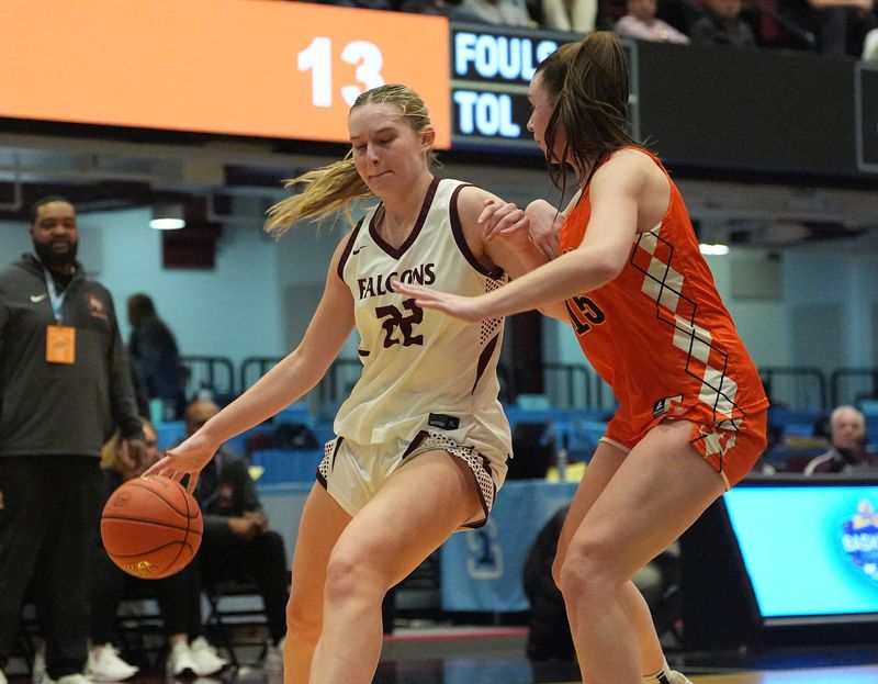 Albertus Magnus' Julia Scott (22) drives on Mamaroneck's Addison Dorfman (15) during the Section 1 Class AAA girls basketball semifinal game at the Westchester County Center in White Plains on Wednesday, March 4, 2026.