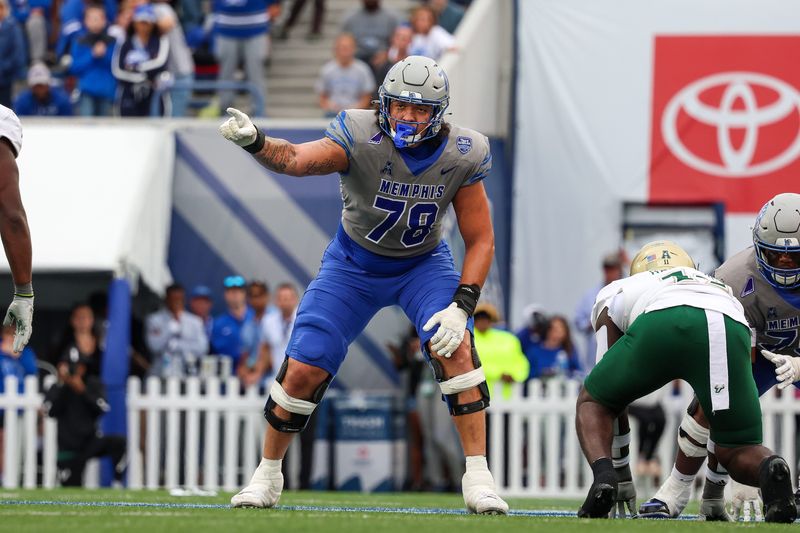 Oct 25, 2025; Memphis, Tennessee, USA; Memphis Tigers offensive lineman Travis Burke (78) gestures toward the South Florida Bulls defense on the line of scrimmage during the second half at Simmons Bank Liberty Stadium. Mandatory Credit: Wesley Hale-Imagn Images