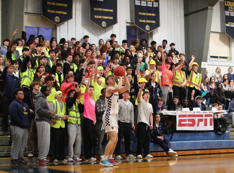 Lourdes’ Justin Jamison lines up a three point shot in front of the home bleachers during the Section 9 Class AAA boys basketball semifinal game versus Newburgh on March 5, 2026.