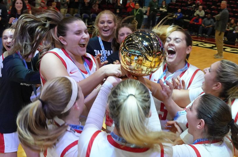Tappan Zee players celebrate with the gold ball after defeating Pelham in the Section 1 girls basketball championship game at the Westchester County Center in White Plains March 6, 2026.