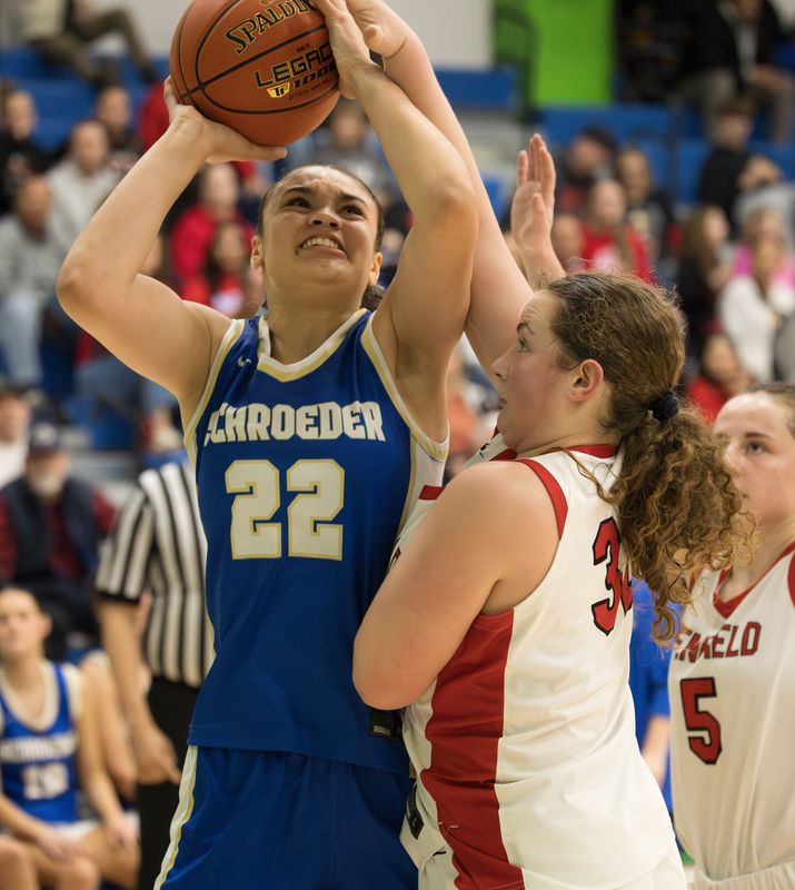 Webster Schroeder's Kenyatta Hart grabs a rebound during the Section V Class AA-1 final Friday, March 7 at Finger Lakes Community College.