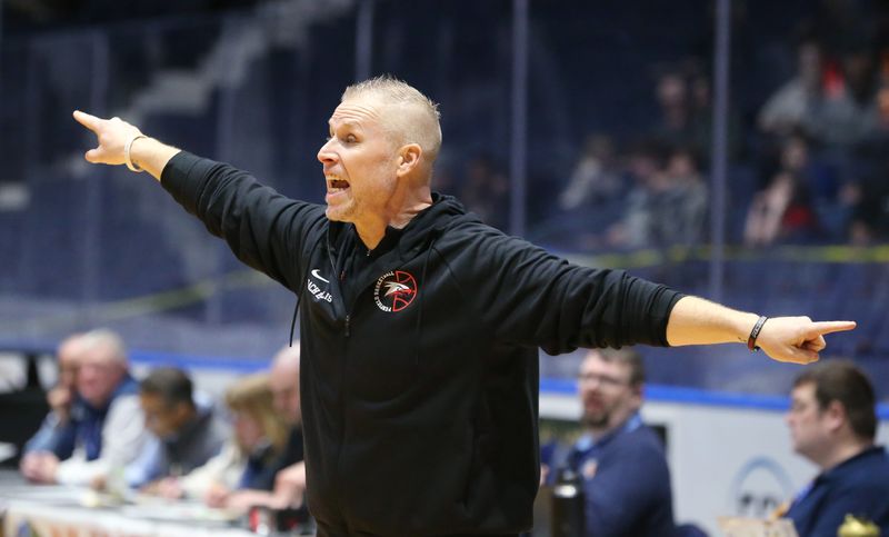 Penfield head coach Jason Ellis sets his defense on a Victor out of bounds play during their Section V Class AA1 boys basketball sectional finals Saturday, March 7, 2026 at Blue Cross Arena in Rochester.